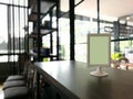 Mock up Menu frame on Table in Bar restaurant cafe Blurred Background, Blank menu board for food and drink concept