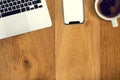 Mock up the office table seen from above. Flat lay smartphone, computer coffee and tablet on a wooden table. Copy space. Modern Royalty Free Stock Photo