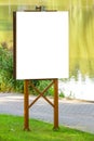 Mock up. Outdoor advertising, blank billboard outdoors, public information board in the park Royalty Free Stock Photo