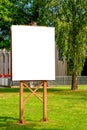 Mock up. Outdoor advertising, blank billboard outdoors, public information board in the park Royalty Free Stock Photo