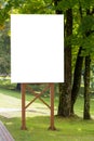 Mock up. Outdoor advertising, blank billboard outdoors, public information board in the park Royalty Free Stock Photo