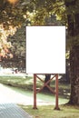 Mock up. Outdoor advertising, blank billboard outdoors, public information board in the park Royalty Free Stock Photo