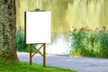 Mock up. Outdoor advertising, blank billboard outdoors, public information board in the park Royalty Free Stock Photo