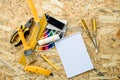 Mock up of paint color samples, painting and repair tools on woo Royalty Free Stock Photo