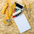 Mock up of paint color samples, painting and repair tools on woo Royalty Free Stock Photo