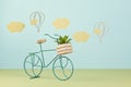 Mock up with paper clouds and flying balloons over the blue pastel background and  toy bicycle Royalty Free Stock Photo