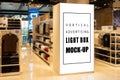 Mock up perspective vertical light box in clothing showroom Royalty Free Stock Photo