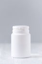 Mock up plastic bottle for medicine, powder, pills, tabs, capsules, selective focus Royalty Free Stock Photo