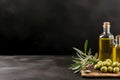 Mock up with plump green olives and bottle of premium olive oil Royalty Free Stock Photo