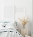 Mock-up poster frame in bedroom, Scandinavian style Royalty Free Stock Photo