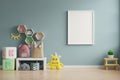 Mock up poster frame in children room,kids room,nursery mockup,blue wall Royalty Free Stock Photo