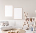 Mock up poster frame in children room with natural wooden furniture on beige background