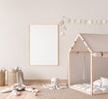 Mock up poster frame in children room with natural wooden furniture on beige background