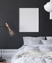 Mock-up poster frame in dark bedroom, Scandinavian style Royalty Free Stock Photo