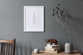 Mock up poster frame and natural interior accessories on the grey wall. Royalty Free Stock Photo