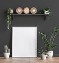 Mock up poster frame near black wall with flowers Royalty Free Stock Photo