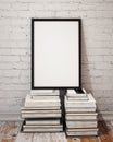 Mock up poster frame on palle of books in loft interior