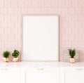 Mock up poster frame in pastel pink kitchen interior