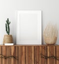 Mock up poster frame on wooden cabinet in home interior Royalty Free Stock Photo