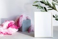 Mock-up poster white frame in modern interior. Minimal composition with a white photo frame and bright fabric, in a Scandinavian i Royalty Free Stock Photo