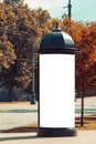 Mock up. Retro style street advertising column stand on sidewalk in the city Royalty Free Stock Photo