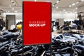 Mock up signboard advertising standing in fashion jeans shop