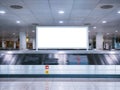 Mock up Signboard Airport Luggage Carousel Conveyor with Baggage on conveyor belt Royalty Free Stock Photo
