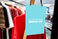 Mock up signboard hanging in t-shirt store Royalty Free Stock Photo