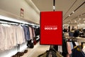 Mock up signboard over hanger in clothing shop Royalty Free Stock Photo