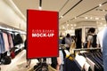 Mock up signboard over hanger in clothing shop Royalty Free Stock Photo