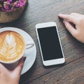 Mock up smart phone with hot coffee Royalty Free Stock Photo