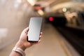 Mock up smart phone on a subway station Royalty Free Stock Photo