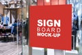 Mock up square shape signboard information at entrance clothing shop Royalty Free Stock Photo