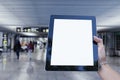 Mock up Tablet in hand closeup on airport background. Concept on the theme of air travel