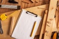 Mock up template clipboard note paper in woodwork carpentry workshop