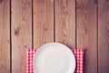 Mock up template with empty plate over wooden background. View from above Royalty Free Stock Photo