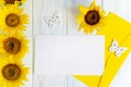 Mock up template with sunflower flowers and an envelope for writing. Frame for text with flowers for greeting card and