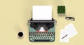 Mock up typewriter paper and pen,eyeglasses,coffee top view on the table colorful education in front of yellow wall lovely picture