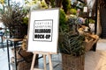 Mock up vertical advertising billboard in frame on wooden stand