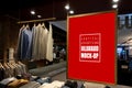 Mock up vertical billboard hanging in clothes shop for men Royalty Free Stock Photo