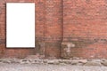 Mock up. Vertical blank billboard, advertising, public information board on old red brick wall Royalty Free Stock Photo