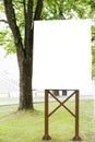 Mock up. Vertical blank billboard with copy space for text message or content public information. City park background Royalty Free Stock Photo