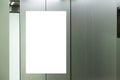 Mock up. Vertical poster media template frame hanging on the wall inside elevator lift Royalty Free Stock Photo