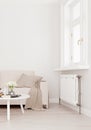 Mock up wall with beige white sofa, two tables and a chair in modern interior background, living room with large window