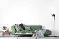 Mock up wall in modern interior , green sofa in living room on empty white wall, Royalty Free Stock Photo