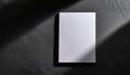 Mock-up of white blank card sheet of paper on black textured surface. Postcard template. Top view Royalty Free Stock Photo