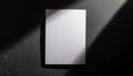 Mock-up of white blank card sheet of paper on black textured surface. Postcard template. Top view Royalty Free Stock Photo