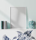 Mock up white blank poster frame in modern orient style interior with light blue wall, books and porcelain vase, japaneese style,