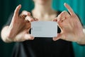 Mock up. woman holding white bussines card Royalty Free Stock Photo