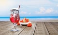 Mocktail Strawberry Soda not mix alcohol. Fresh strawberries in ceramic bowl in the background blur on plank wood table.